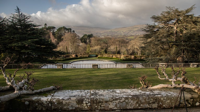View across the Lily terrace in winter to Eryri (Snowdonia) at Bodnant Garden